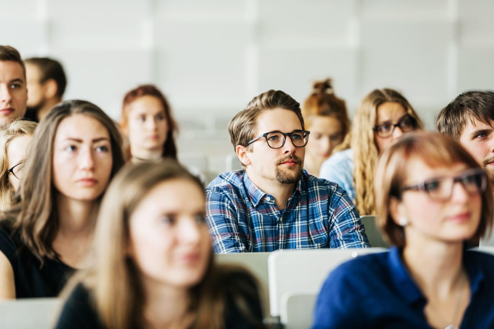 University classroom with students using laptops